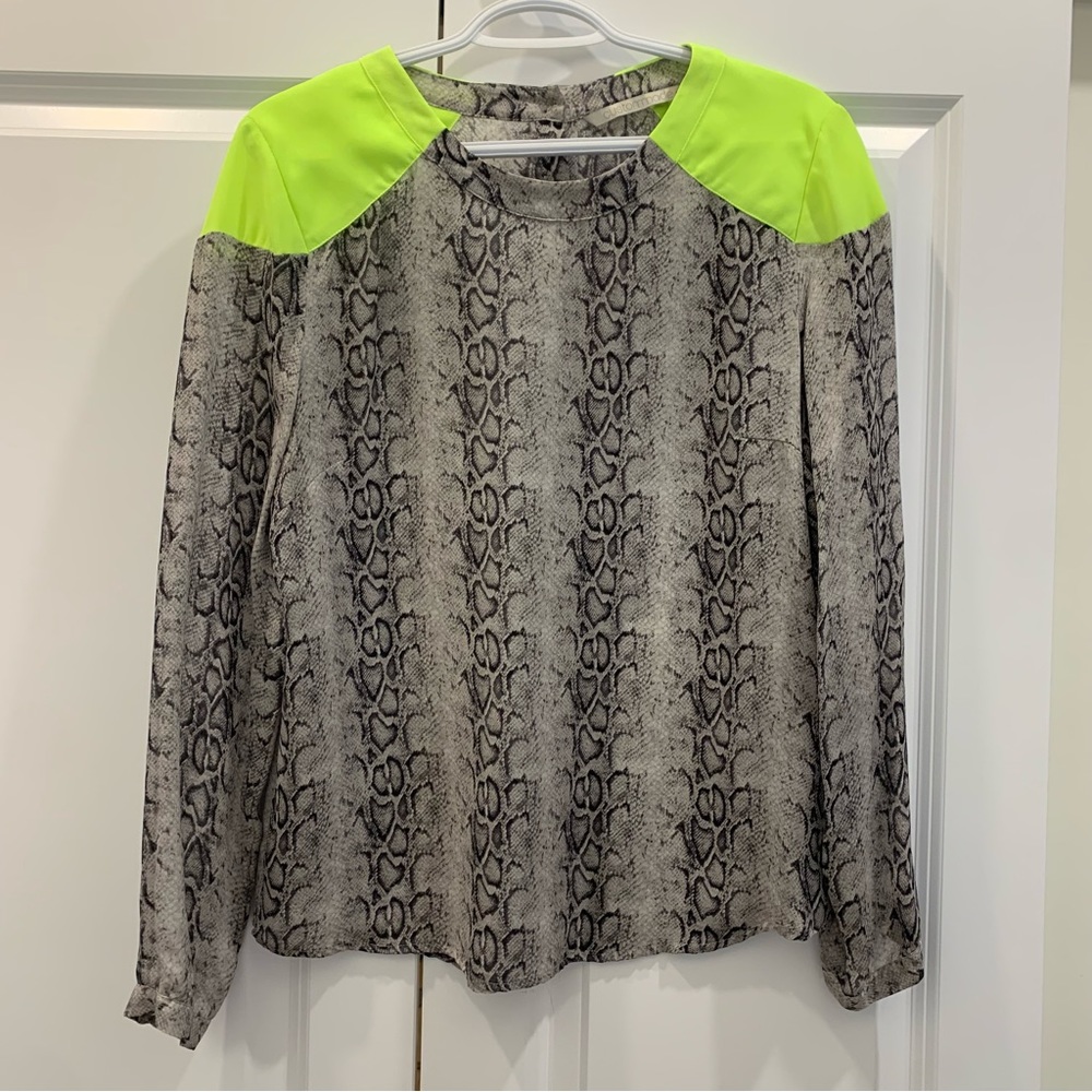 Snake print blouse with neon shoulder detail, and button up back
